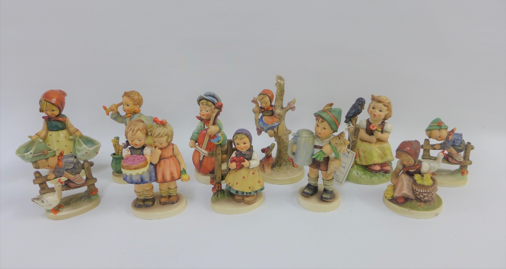 Collection of eleven Goebel and Hummel figures to include 'Happy Birthday' etc, tallest 16cm (11)