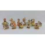 Collection of eleven Goebel and Hummel figures to include 'Happy Birthday' etc, tallest 16cm (11)