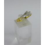 Diamond claw set solitaire ring on a plain white and yellow 18 carat gold band, full set of