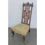 Mahogany and rosewood high back chair in the Gothic manner with scrolling top rial and barley