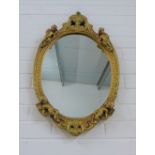 Faux giltwood wall mirror with oval plate 65 x 42cm