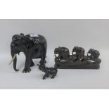 A collection of ebonised hardwood elephants, tallest 18cm (3)