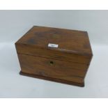 19th century mahogany sewing box, the hinged lid opening to reveal two slide out trays above a green