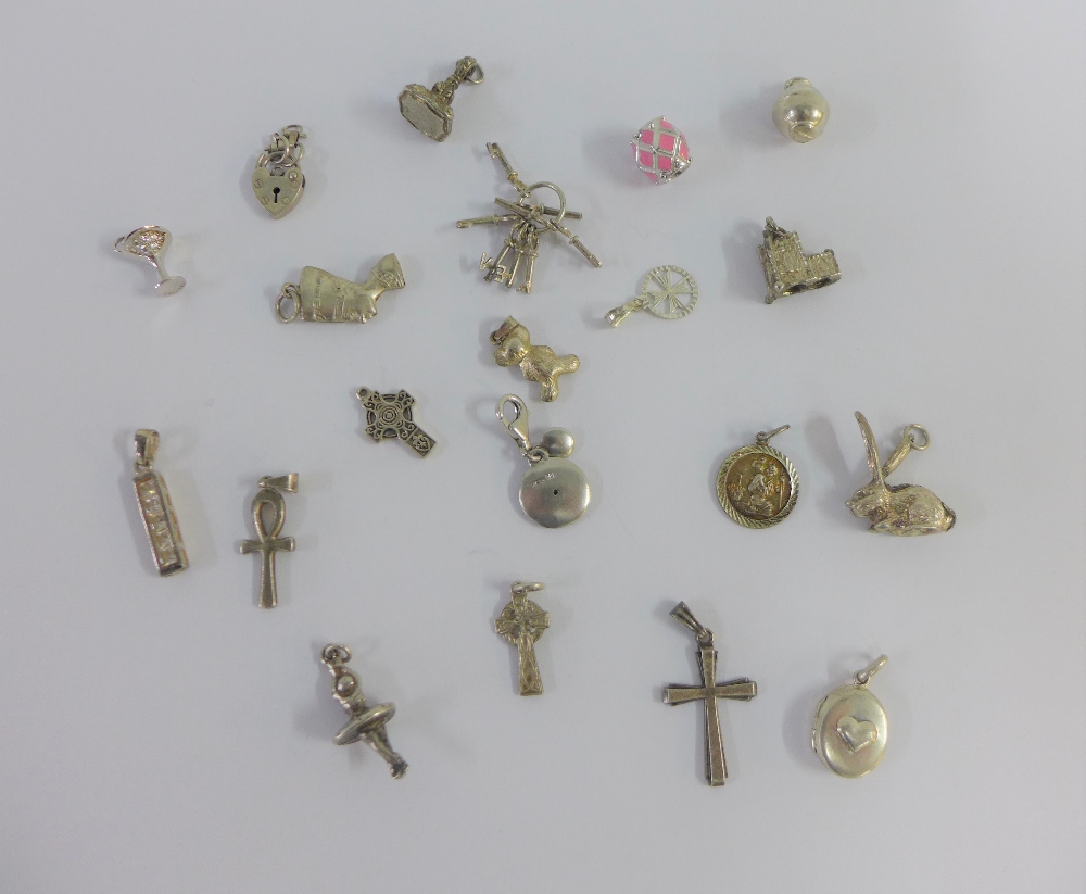 Twenty various silver charms (20)