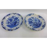 Two Delft type blue and white tin glazed chargers, 35cm diameter (2) (a/f)