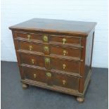 An oak chest, the rectangular top over an arrangement of six graduated doors with brass handles ,