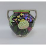 Bough Scottish pottery twin handled vase hand painted with stylised flowers to a black ground,