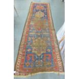 Kazak style runner the worn blue field and flowerhead borders, 102 x 340cm approx