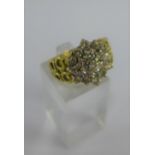 18 carat gold diamond cluster dress ring, the gold band with pierced design, full 750 hallmarks,