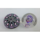 Strathearn millefiore glass paperweight and another (2)