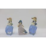 Three Nao figurines of girls with their puppy dogs, tallest 19cm (3)