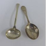 Two continental silver spoons with hand hammered finish, one with an engraved flowerhead motif,