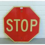 A vintage red and white enamel Stop sign of hexagonal shape, possibly American, 61 x 61cm