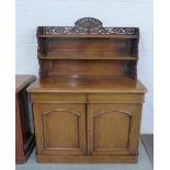 Victorian rosewood credenza with a fretwork frieze over shelved back above a pair of panelled