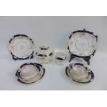 19th century English porcelain teaset comprising nine cups, five saucers, twelve side plates,