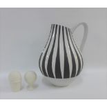 Continental pottery black and white glazed jug, 29cm high together with a pair of white bisque