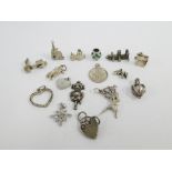 Twenty various silver charms (20)