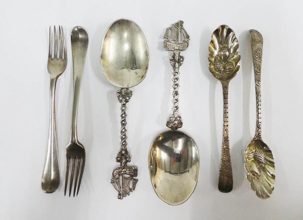 Pair of Continental silver spoons with sail boat finials, a pair of London silver berry spoons and a