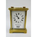 Brass and glass panelled carriage clock, height including handle 14cm