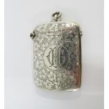 Late Victorian silver vesta with hinged lid and foliate engraved pattern, Chester 1900, 5.5cm,