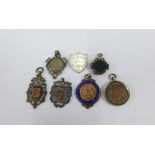 Seven various silver fobs (7)