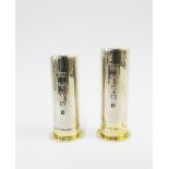 A pair of silver and gilt 'Shotgun Cartridge' salt and pepper condiments, Laurence R Watson & Co,