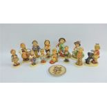 A collection of thirteen Hummel & Goebels figures, etc, tallest 13cm, (13)