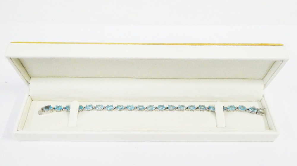 Silver and pale blue gemstone tennis style bracelet, boxed