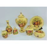 A quantity of Aynsley Orchard Gold patterned china to include a vase with cover, jar and cover,