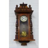 Mahogany cased Vienna style wall clock with circular enamel dial with Roman numerals to the