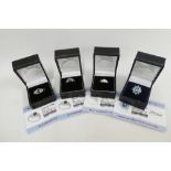 Four contemporary silver gemset dress rings, boxed (4)