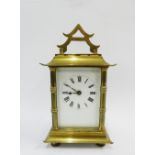 French brass and glass panelled chinoiserie carriage clock with faux bamboo uprights and stylised