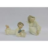 Lladro figure of an angel and Nao figure of a boy, with printed backstamps, tallest 15cm (2)