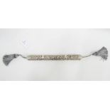 A pierced and ornate white metal Torah scroll holder, unmarked but tests as 925 silver, 35cm long