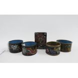 Cloisonne match box cover and four various cloisonne napkin rings, (5)