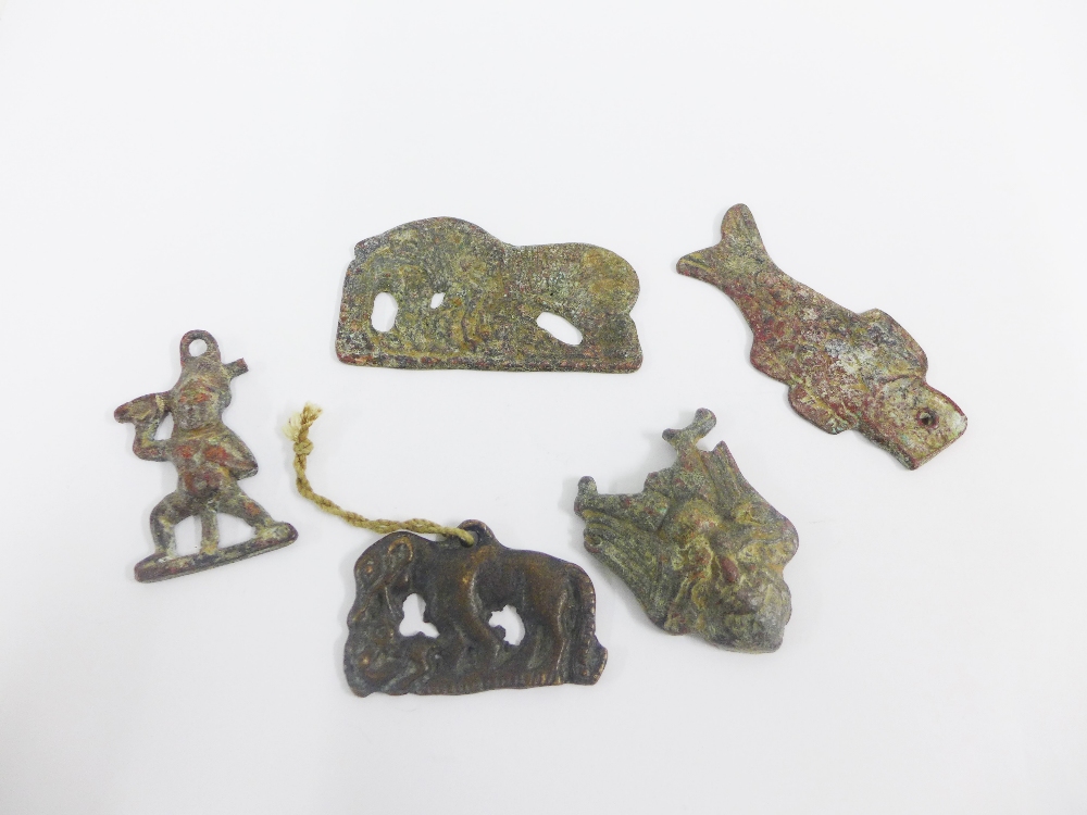 Five south East Asian bronze plaques, possibly Tibetan, largest 9cm (5)