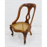 Mahogany chair with canework seat, on ceramic castors 80 x 47cm