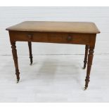 19th century mahogany writing table, with two drawers and raised on turned supports, terminating