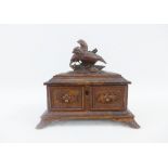 Black Forest style carved wooden box, the hinged lid with birds, on bracket feet, 20 x 18cm