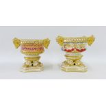 Two Derby pot pourri vases, each with gilded mask heads and on a quatrefoil base, 11cm high (2)