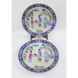 Pair of chinoiserie famille rose plates with blue border and painted with figures, 37cm diameter (2)