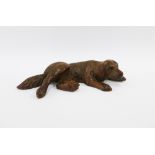 Black Forest style carved dog figure, 15cm long