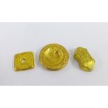 Three Chinese gilt metal ingots, inscribed with Chinese characters, largest 6cm (3)
