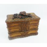 Black Forest style carved wooded box , the hinged lid applied with flowers and foliage, 23 x 16cm