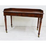 19th century mahogany ledgeback writing table with two frieze drawers with bun handles, raised on