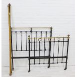 Victorian black metal single bed with brass finials and side rails.