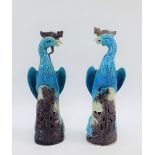 A pair of Chinese turquoise glazed bird figures, 19cm high (2)