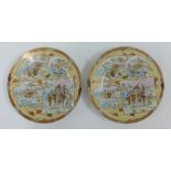 Pair of Satsuma porcelain plates, finely painted with figures, blossom and landscape, 23cm diameter,