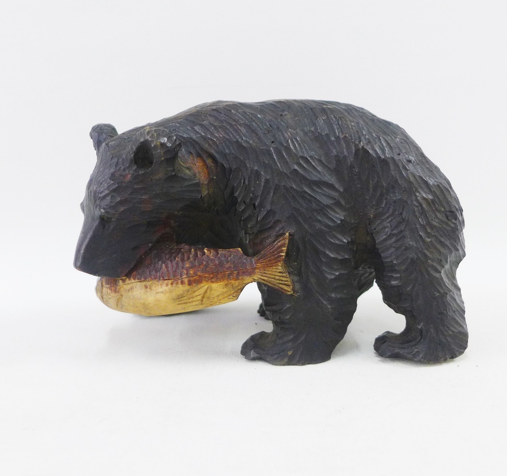 Black Forest style carved wooden Bear with a Fish, 20cm long