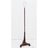 Mahogany standard lamp with triform bases and three bun feet, 150cm high
